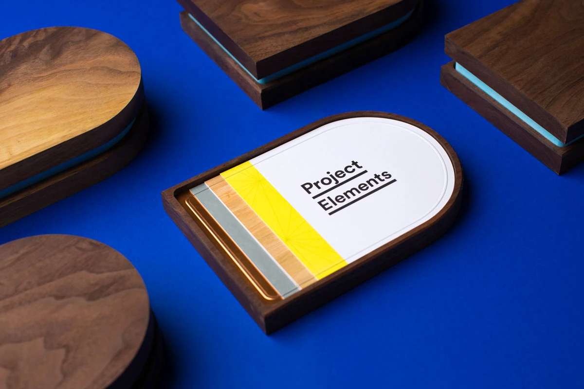 Project Elements branding displayed on a wood material tray